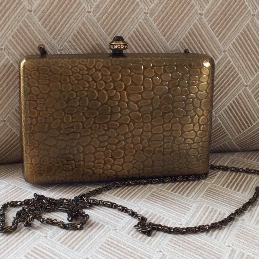 Gold color hard case evening bag. Great color